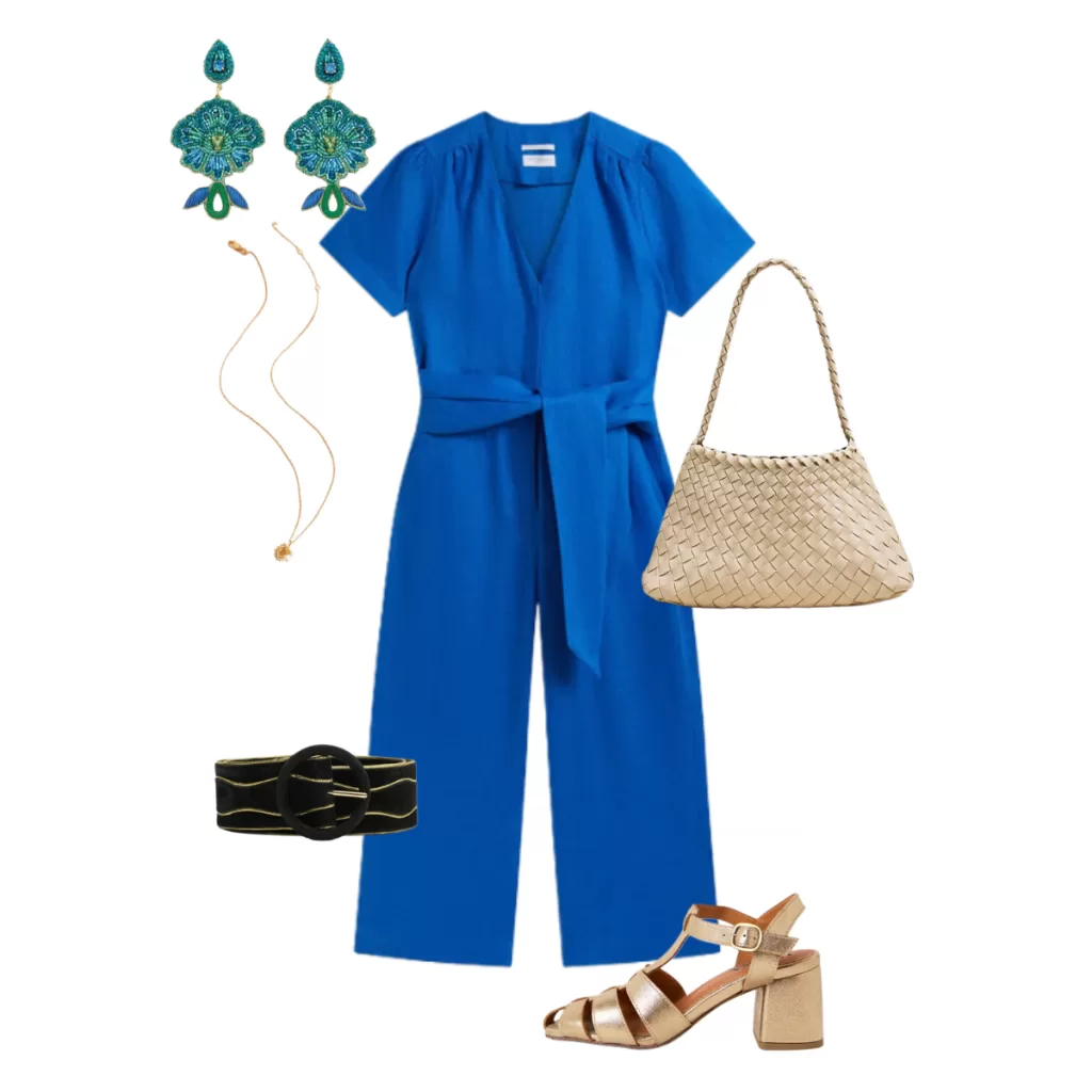 Flat lay of a women's occasion outfit featuring a cobalt blue belted jumpsuit, gold block heel sandals, woven cream handbag, statement blue earrings, gold necklace and a black waist belt.